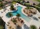 Community pool featuring lounge areas and landscaping with palm trees at 459 Dancing Water Dr, Winter Springs, FL 32708