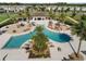 Aerial view of a community pool with lounge chairs and covered seating areas at 459 Dancing Water Dr, Winter Springs, FL 32708