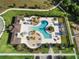 Overhead aerial of a community pool area featuring palm trees and inviting lounge areas at 459 Dancing Water Dr, Winter Springs, FL 32708