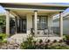 Inviting front porch with stylish pillars, seating, and lush landscaping enhancing curb appeal at 459 Dancing Water Dr, Winter Springs, FL 32708