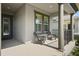 Inviting front porch with comfortable seating, supported by stately columns, offering a relaxing outdoor space at 459 Dancing Water Dr, Winter Springs, FL 32708