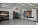 Spacious two car garage with ample storage cabinets, slatwall, and epoxy floor at 459 Dancing Water Dr, Winter Springs, FL 32708