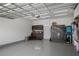 Spacious two car garage with ample storage cabinets, slatwall, and epoxy floor at 459 Dancing Water Dr, Winter Springs, FL 32708
