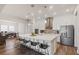Spacious kitchen with a large island, bar seating, and stainless steel appliances at 459 Dancing Water Dr, Winter Springs, FL 32708