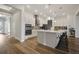 Modern kitchen featuring a large island, stainless steel appliances, stylish backsplash, and ample cabinet space at 459 Dancing Water Dr, Winter Springs, FL 32708