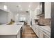 Modern kitchen with stainless steel appliances, white cabinets, and a large island at 459 Dancing Water Dr, Winter Springs, FL 32708