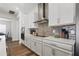 Bright kitchen with stainless steel appliances, white cabinets, and backsplash at 459 Dancing Water Dr, Winter Springs, FL 32708