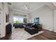 Bright living room with tray ceilings, large windows, and waterfront views at 459 Dancing Water Dr, Winter Springs, FL 32708