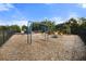 Community playground with swings, slides, and a merry-go-round with protective mulch ground cover at 459 Dancing Water Dr, Winter Springs, FL 32708