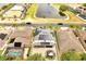 An aerial view of a home with solar panels, a patio, and a manicured lawn at 460 Crownclover Ave, Orlando, FL 32828