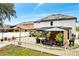 Backyard with patio area, gazebo, white fence and solar panels at 460 Crownclover Ave, Orlando, FL 32828