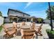 Beautiful backyard featuring a firepit, outdoor kitchen and seating area, with stone pavers at 460 Crownclover Ave, Orlando, FL 32828
