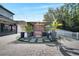 Landscaped backyard with an outdoor gazebo, stone pavers, and manicured plants at 460 Crownclover Ave, Orlando, FL 32828