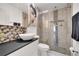 Modern bathroom showcases a sleek vanity, vessel sink, and glass enclosed tiled shower at 460 Crownclover Ave, Orlando, FL 32828