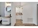 Elegant bathroom with modern vanity, vessel sink, and wood accents at 460 Crownclover Ave, Orlando, FL 32828