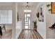Bright entryway featuring modern accents and beautiful flooring at 460 Crownclover Ave, Orlando, FL 32828