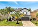 Charming two-story home with landscaped yard and a two-car garage at 460 Crownclover Ave, Orlando, FL 32828