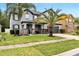 Charming two-story home with landscaped yard and a two-car garage at 460 Crownclover Ave, Orlando, FL 32828