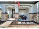 Inviting front porch with stone accents and outdoor seating at 460 Crownclover Ave, Orlando, FL 32828