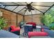 Outdoor gazebo with comfortable seating, ceiling fan, and stylish decor at 460 Crownclover Ave, Orlando, FL 32828