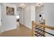 Hallway with wood flooring, light fixtures and a view into the living area at 460 Crownclover Ave, Orlando, FL 32828