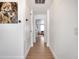 Hallway with hard wood floors and a view into the living area at 460 Crownclover Ave, Orlando, FL 32828