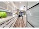 Sleek kitchen with white cabinetry, quartz countertops, and high-end appliances at 460 Crownclover Ave, Orlando, FL 32828