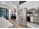 Stylish kitchen with stainless appliances, modern cabinets, and bar-height countertop seating at 460 Crownclover Ave, Orlando, FL 32828