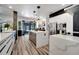 Spacious kitchen with center island, stainless steel appliances, and modern cabinetry at 460 Crownclover Ave, Orlando, FL 32828