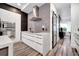 Modern kitchen featuring sleek cabinets, stainless steel appliances, and a stylish range hood at 460 Crownclover Ave, Orlando, FL 32828