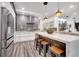 Modern kitchen with a center island, stainless steel appliances, and pendant lighting at 460 Crownclover Ave, Orlando, FL 32828