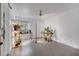 Bright living room with sleek hardwood floors, modern lighting, and lots of natural light at 460 Crownclover Ave, Orlando, FL 32828