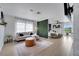 Bright open-concept living room adjacent to bedroom area with ample natural light at 460 Crownclover Ave, Orlando, FL 32828