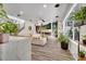 Bright living room with fireplace, large TV, wood-look floors and neutral furnishings at 460 Crownclover Ave, Orlando, FL 32828