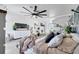 Primary bedroom with accent wall and large ceiling fan at 460 Crownclover Ave, Orlando, FL 32828