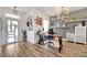 Bright home office featuring a modern desk, stylish shelving, and wood-look floors at 460 Crownclover Ave, Orlando, FL 32828