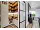 Well-organized pantry with custom shelving, storage baskets, and a frosted glass door at 460 Crownclover Ave, Orlando, FL 32828