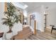 Contemporary staircase with wood steps, sleek metal railings, and abundant natural light at 460 Crownclover Ave, Orlando, FL 32828