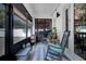 Relaxing sunroom with rocking chairs, natural light, and bamboo shades at 460 Crownclover Ave, Orlando, FL 32828