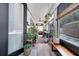 Bright sunroom filled with plants, wooden bench, and a cozy atmosphere at 460 Crownclover Ave, Orlando, FL 32828