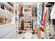 Bright walk-in closet offers custom shelving and lots of storage at 460 Crownclover Ave, Orlando, FL 32828