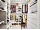 Organized walk-in closet featuring shelving, hanging rods, and drawers for ample storage space at 460 Crownclover Ave, Orlando, FL 32828