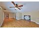 Large bedroom featuring wood flooring, ceiling fan, and ample natural light at 505 S Cooper St, New Smyrna Beach, FL 32169