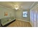 Charming bedroom featuring a daybed, plush carpet, and a closet for storage at 505 S Cooper St, New Smyrna Beach, FL 32169