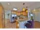 Stylish kitchen features a granite countertop bar, stainless steel appliances, and wooden cabinets at 505 S Cooper St, New Smyrna Beach, FL 32169