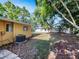 A spacious backyard with lush greenery and partial shade at 5939 Stokes Rd, Lakeland, FL 33812