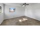 A light and airy bedroom features ceramic tile floors and a large window at 5939 Stokes Rd, Lakeland, FL 33812