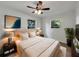 Cozy bedroom with plush bedding, soft lighting and windows with lovely outdoor views at 5939 Stokes Rd, Lakeland, FL 33812