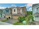 Charming two-story townhomes boasting attached garages, manicured lawns, and welcoming curb appeal at 6863 Tussilago Way, Orlando, FL 32822