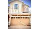 Attached two car garage door with decorative windows, hardware, and the house number above at 6863 Tussilago Way, Orlando, FL 32822